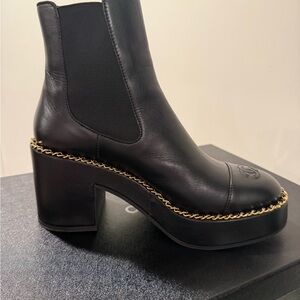 CHANEL Black Heeled Boots with Gold Chain accent